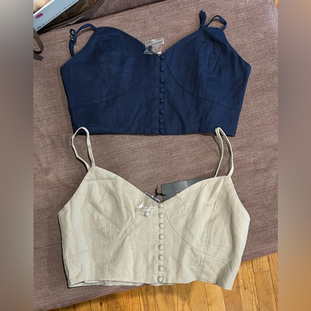 Women’s tank top - one beige and one dark blue.  Large. New with tag